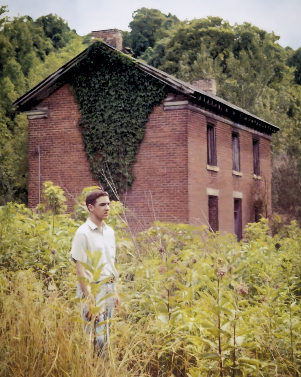 Mark Still in front of the Willis McKeand brick house.